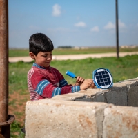 Boy using a solar panel