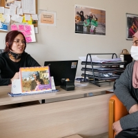 Two women in an office are talking