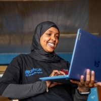 Woman holding a laptop