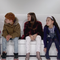 Children seated in a sofa.