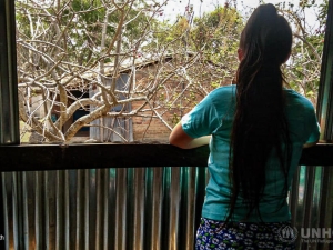 Woman standing on a balcony