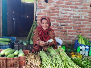 Women farmer selling vegetable at collection center -Helvetas-Jahangir Kabir