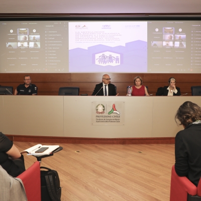 People sitting on a panel talking