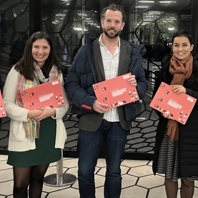 Group photo of people holding report which was launched at the event