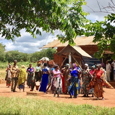 Women dancing outside.