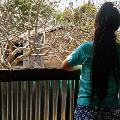 Woman standing on a balcony