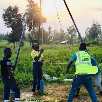 AEDR workers setting up a well in DRC