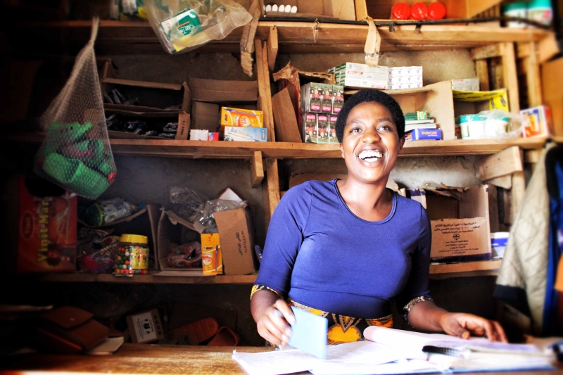 A woman smiles at the camera