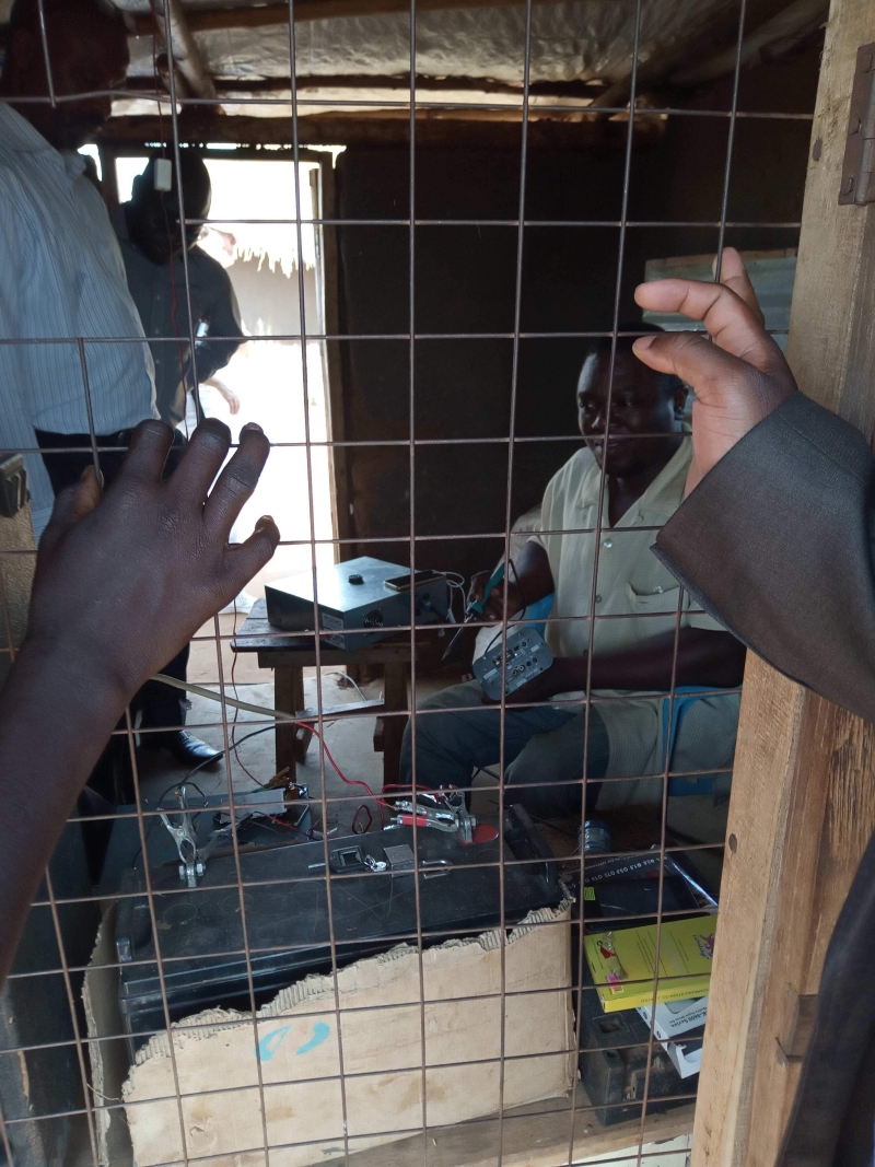 A man is working using the solar cooker