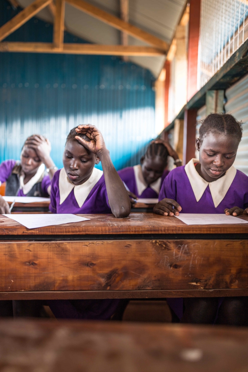 Four girls sitting at their desk studying