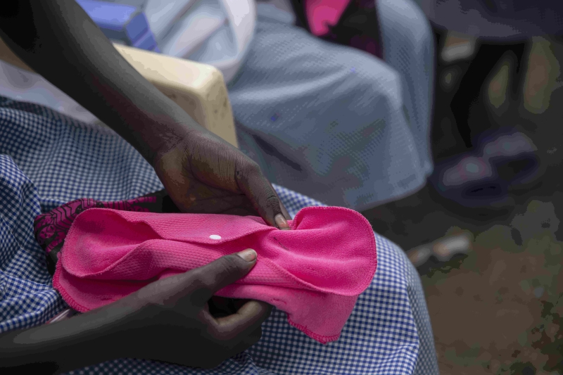 Hands holding reusable pads