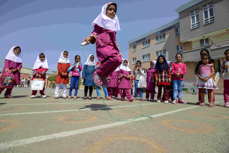 Girl skipping in a playground