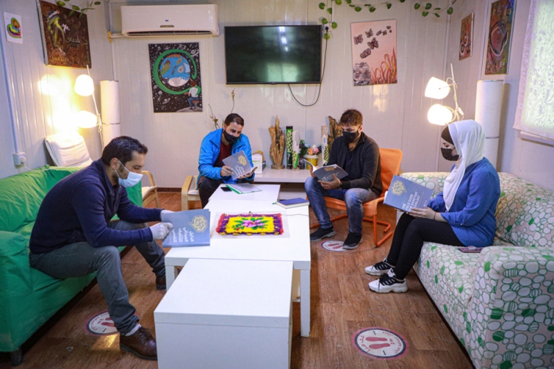 A group of people reading textbooks