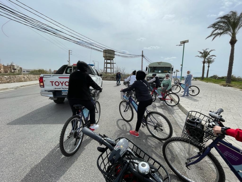 Group riding bikes along a road