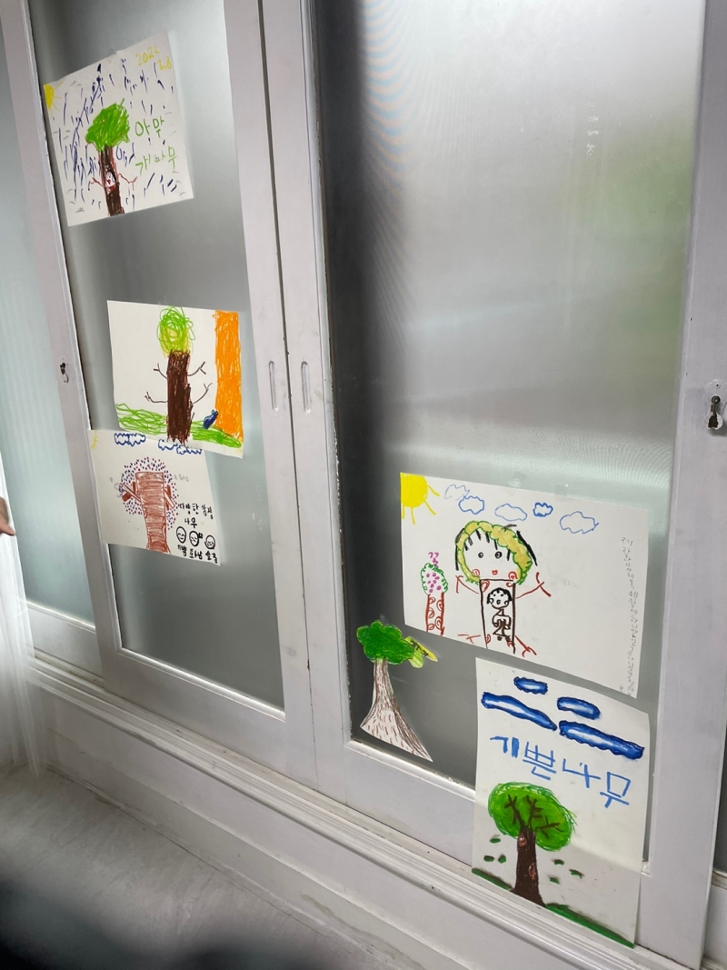 Drawings made by children up on a wall