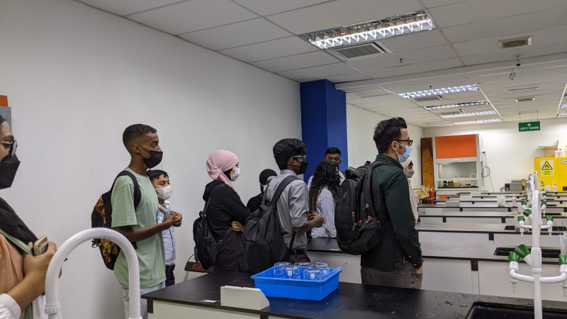 Students wearing masks in a laboratory classroom