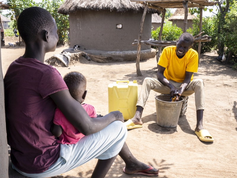 A family sitting in a village