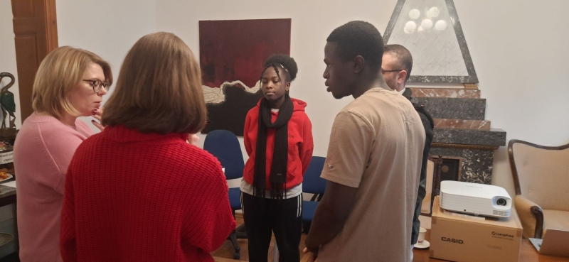People standing in a meeting