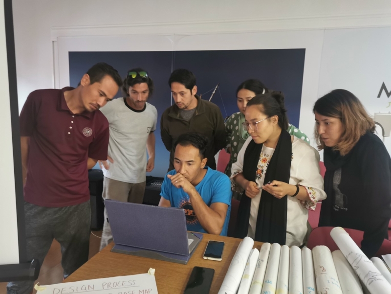People standing around a computer