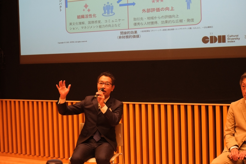 A man speaks into a microphone