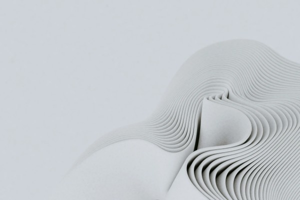 A white cloth, folded many times, on a white background
