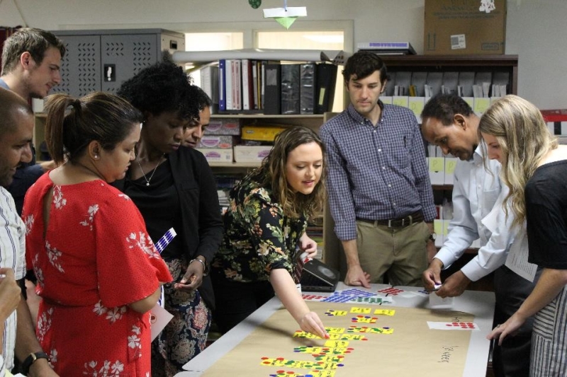 People working on a project together around a table.