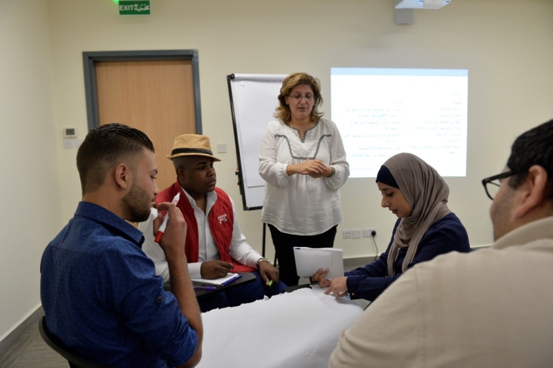People at a classroom working together.