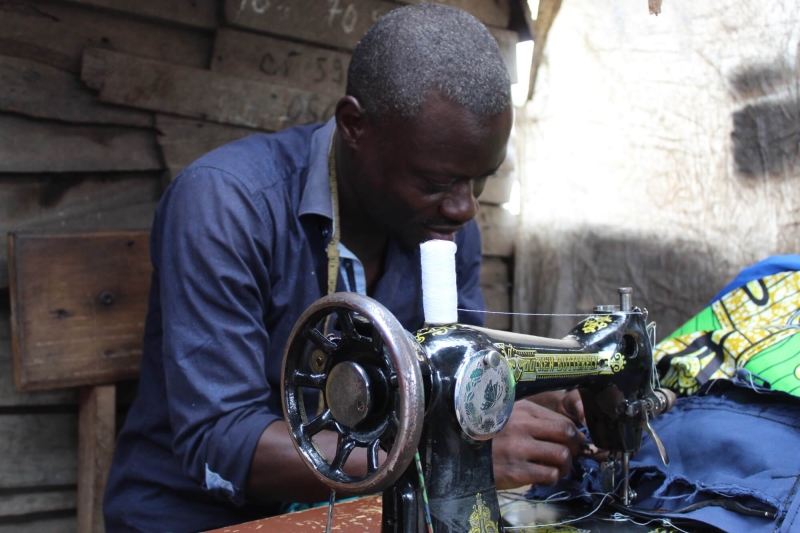 Jean-Pierre at work using his sewing machine