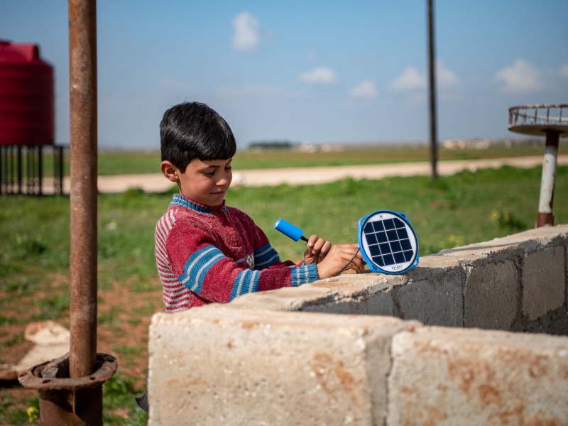 Boy using a solar panel