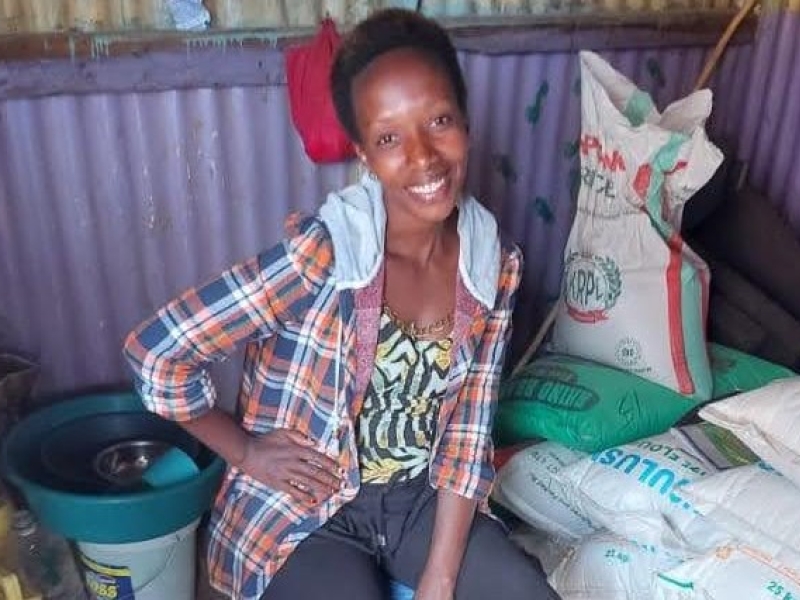 Esperence at her maize flour business