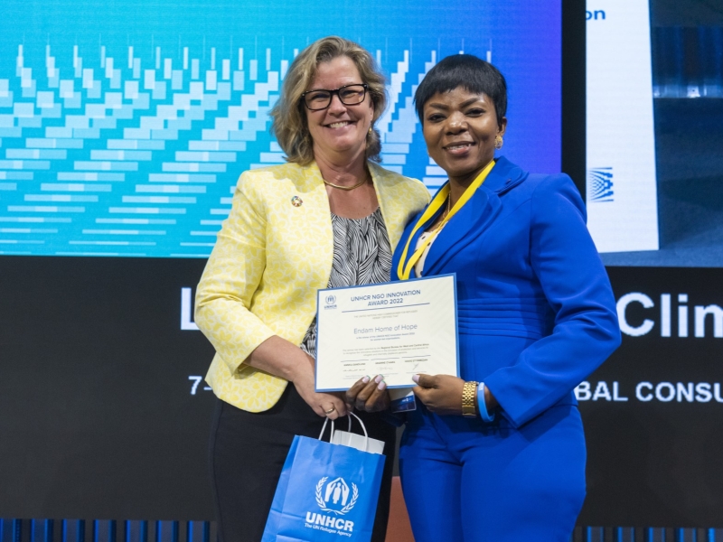 Yvonne Ndaga, Endam Home of Hope, of Nigeria, winner of a 2022 NGO Innovation Award, receiving her award from UNHCR Deputy High Commissioner, Kelly Clements