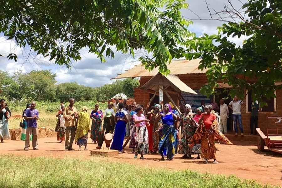 Women dancing outside.