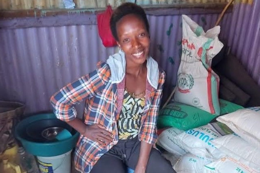 Esperence at her maize flour business