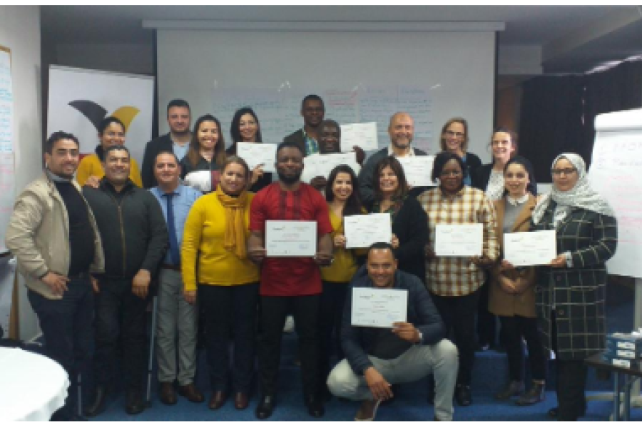 People standing holding a certificate.