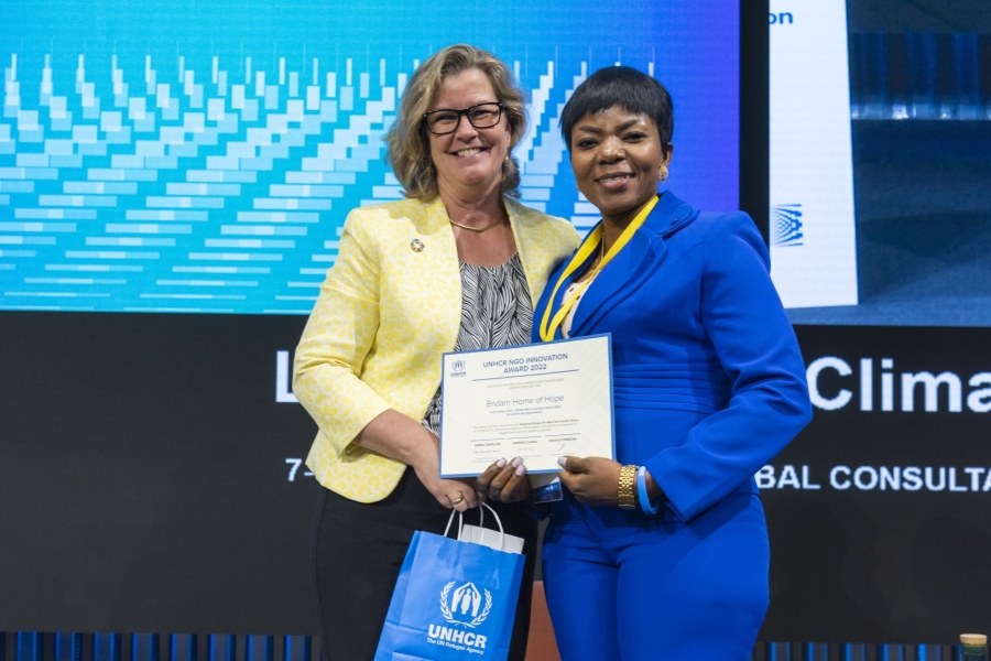 Yvonne Ndaga, Endam Home of Hope, of Nigeria, winner of a 2022 NGO Innovation Award, receiving her award from UNHCR Deputy High Commissioner, Kelly Clements