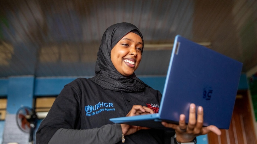 Woman holding a laptop