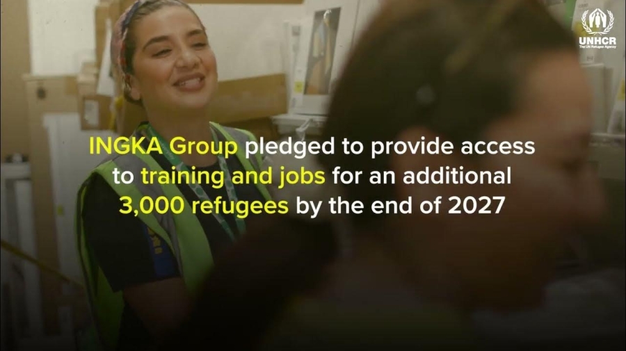 A still from the video showing a woman in protective clothing smiling in a warehouse, and the words "INGKA Group pledged to provide access to training and jobs for an additional 3,000 refugees by the end of 2027"